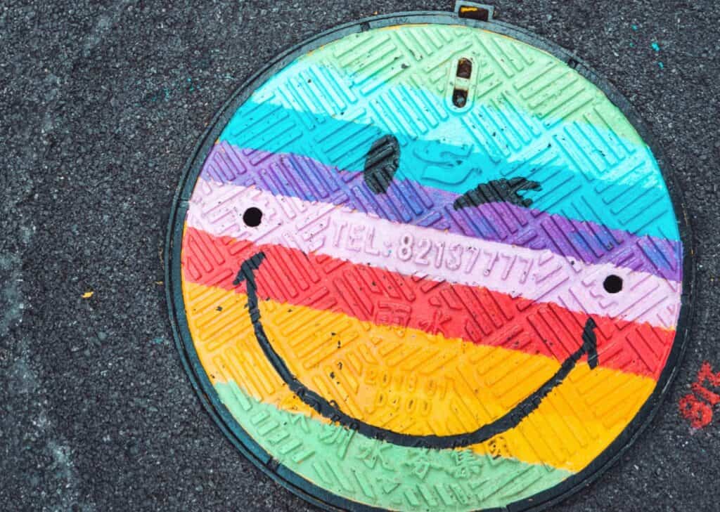NHS rainbow painted drain cover