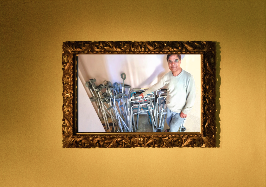 Able Williams and the disability equipment he had flown over to a charity in Pakistan